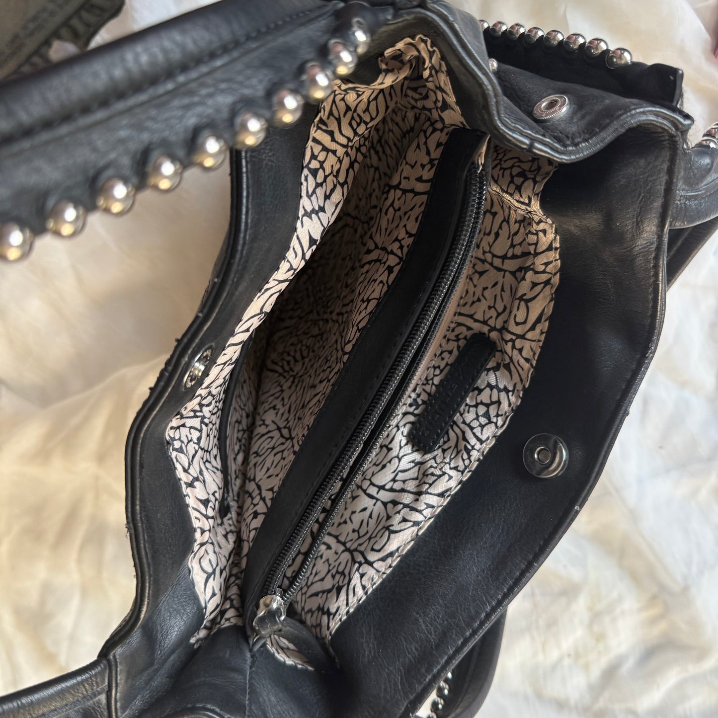 Studded zipper shoulder bag