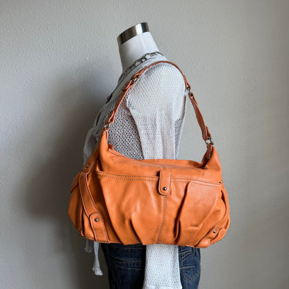 Carly’s orange shoulder bag