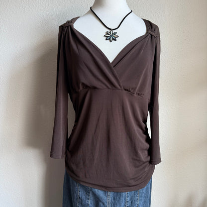 April’s brown sleeved top