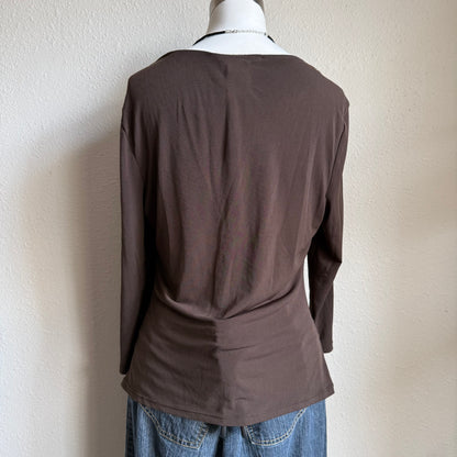 April’s brown sleeved top