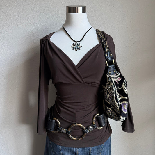 April’s brown sleeved top