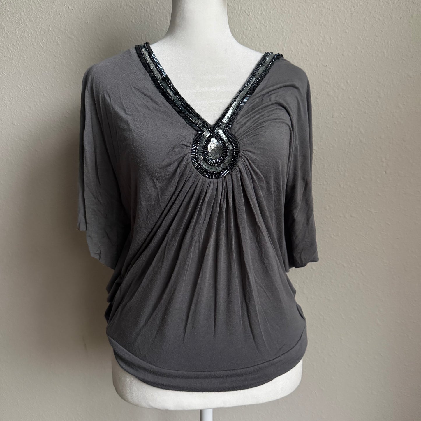 Gray beaded batwing top