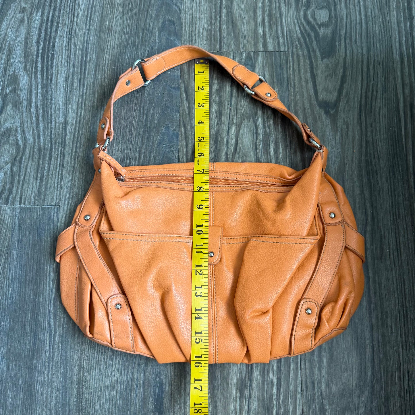 Carly’s orange shoulder bag