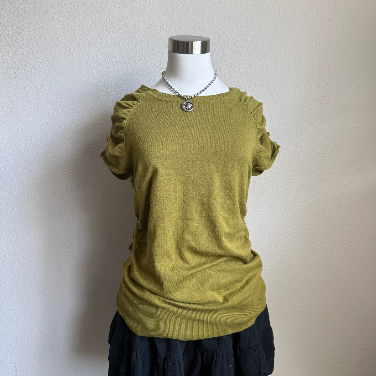 Olivia’s green office top