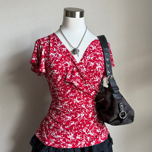 Lana’s red floral top