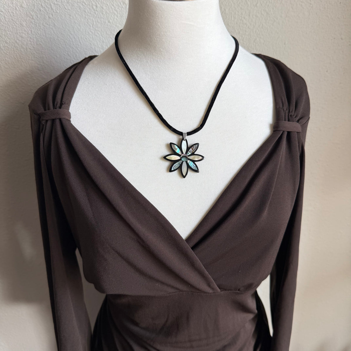 April’s brown sleeved top