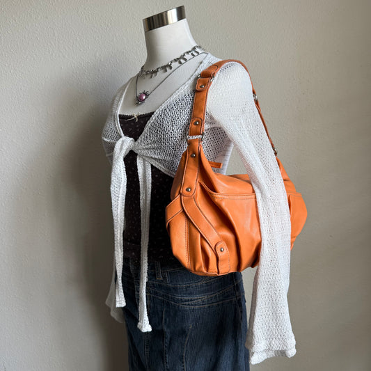 Carly’s orange shoulder bag