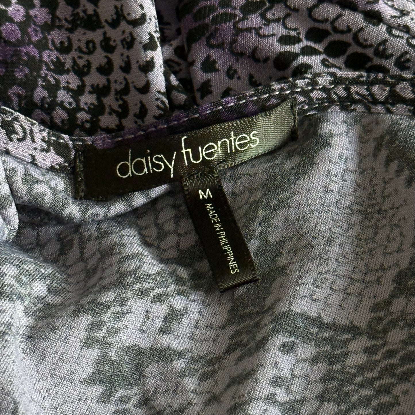 Purple snakeskin ruffle top