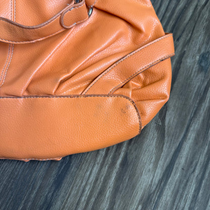 Carly’s orange shoulder bag