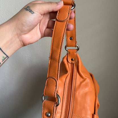 Carly’s orange shoulder bag